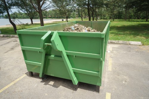 Professional furniture disposal service vehicle on city street